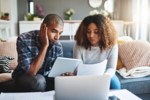 young-couple-looking-at-information-and-trying-to-make-a-decision