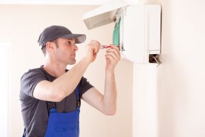 HVAC-technician-performing-ductless-mini-split-maintenance
